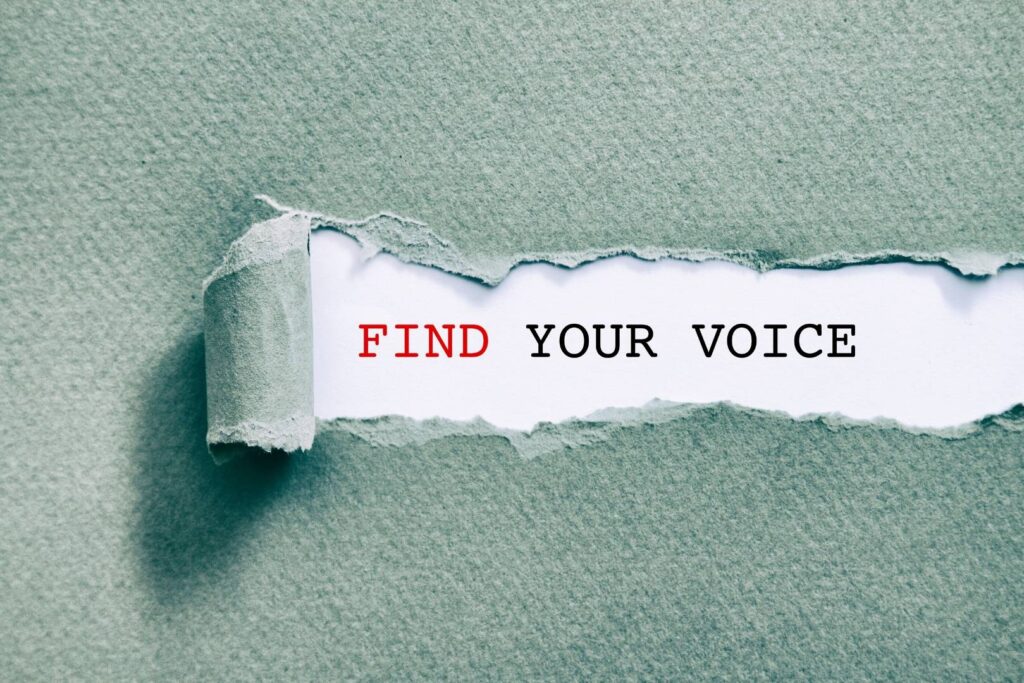 Find Your Brand Voice paper tearing to reveal words
