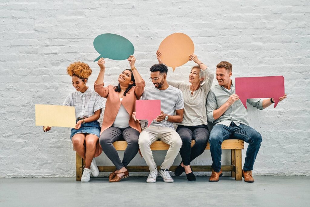 Find Your Brand Voice - People Holding Quote Bubbles