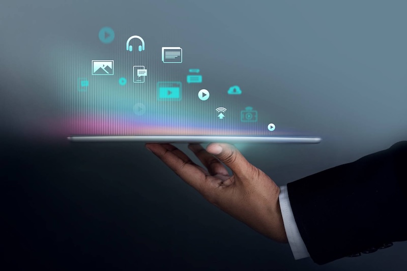 Upward Arrow Fractional CMO Services Featured Fractional CMO Services - Executive with tablet showing digital marketing